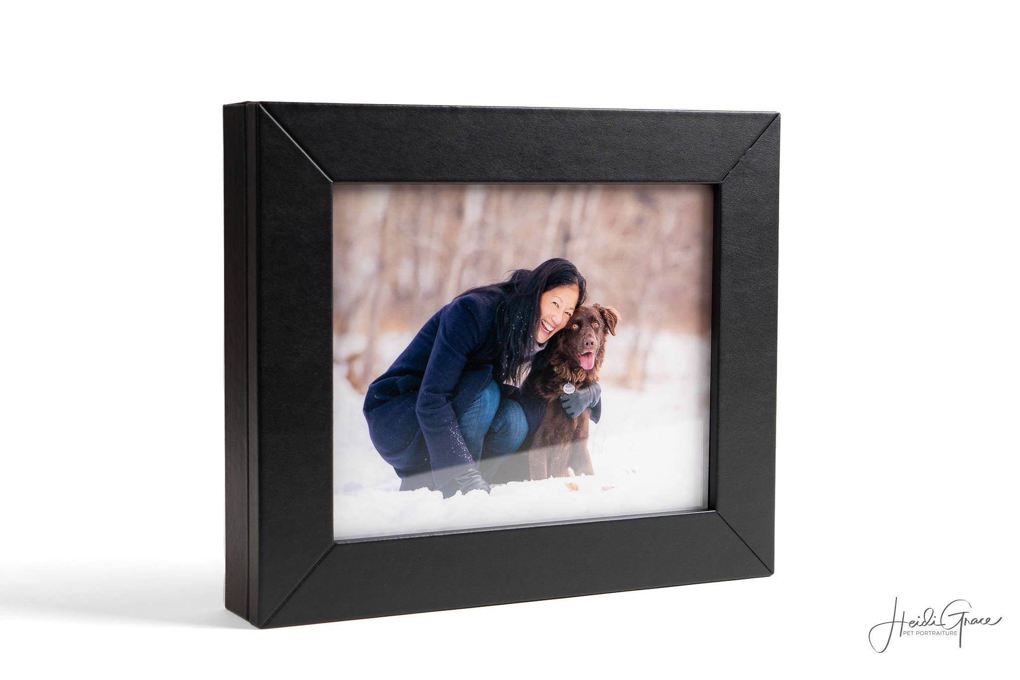 photo of a window portrait box showing a portrait of a dog mom cuddling her dog.